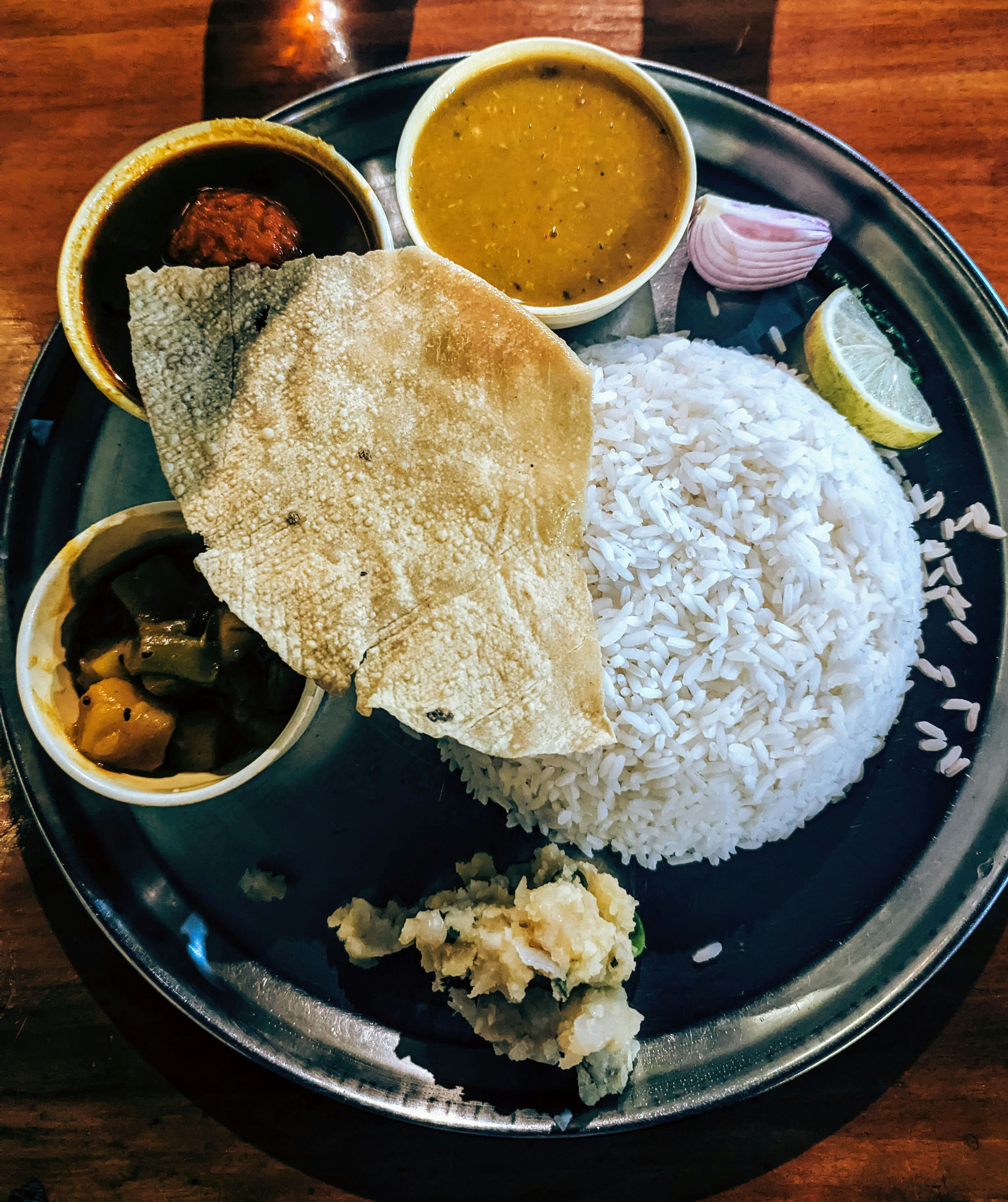 A traditional thali laid out on brass