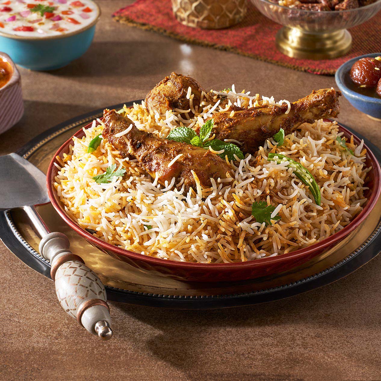 Hyderabadi dum biryani in a copper handi